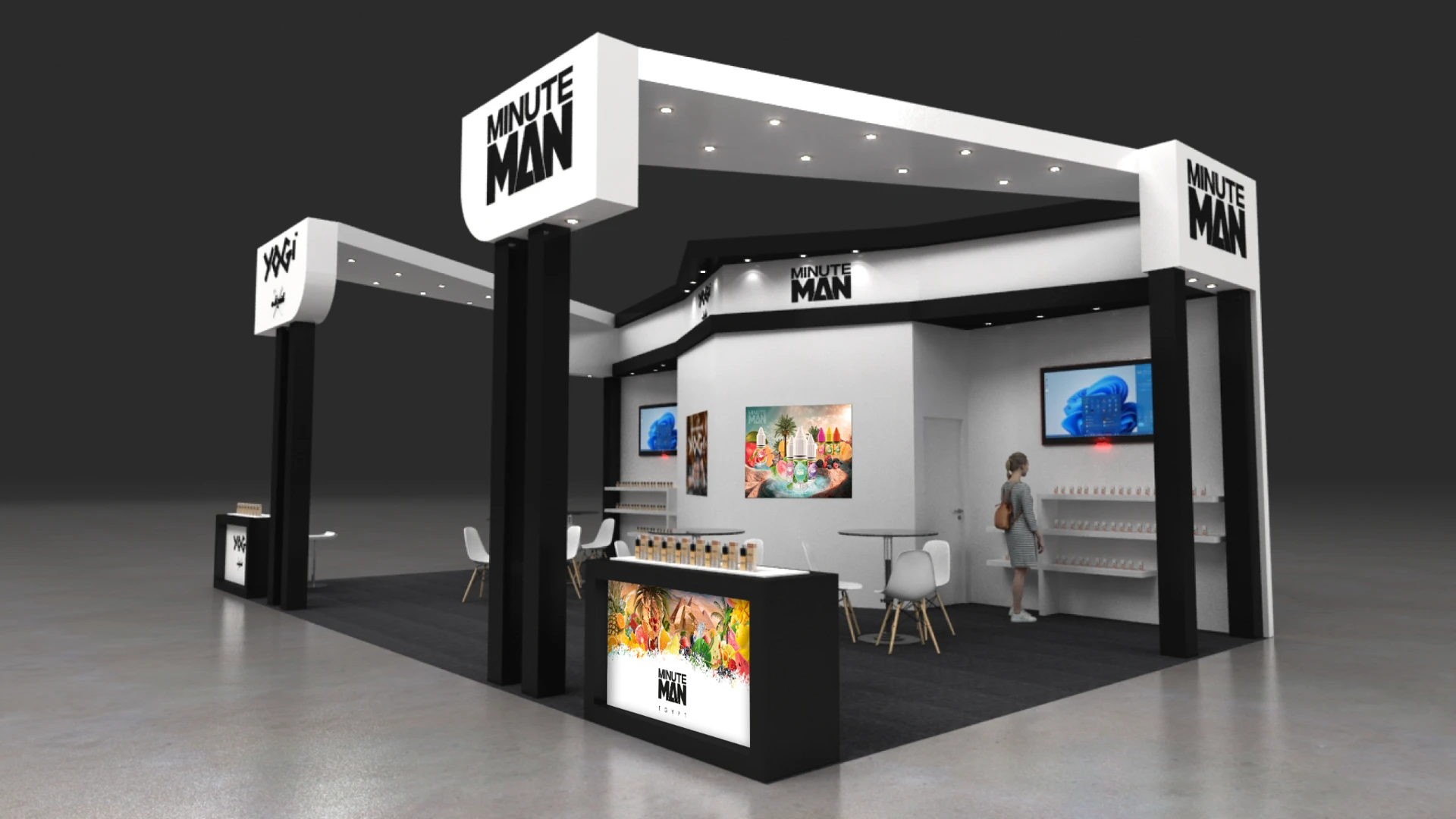 Minute Man exhibition stand with black and white signage, product graphics and a branded counter
